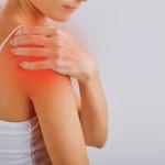 woman with shoulder pain from bursitis or tendinitis