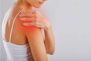 woman with shoulder pain from bursitis or tendinitis