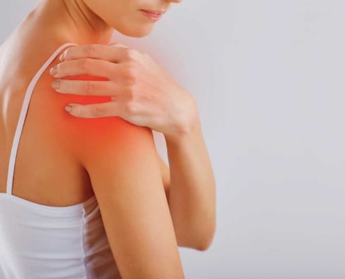 woman with shoulder pain from bursitis or tendinitis