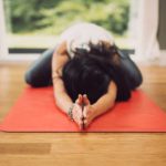 woman practicing yoga / mind body therapy