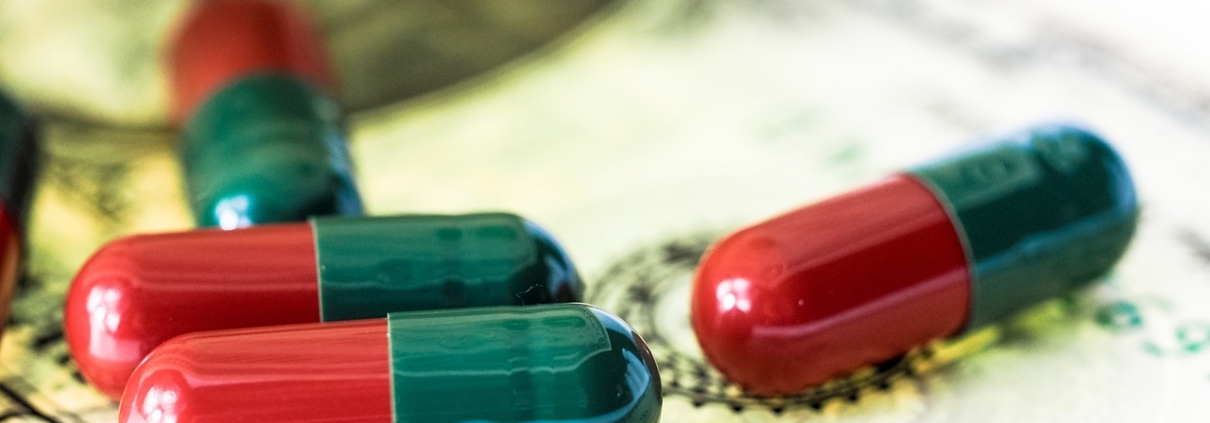 prescription medication laying on top of dollar bill
