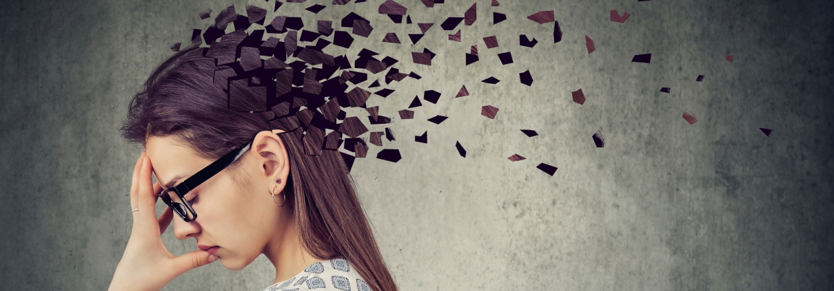 Young woman losing parts of head as symbol of decreased mind function.