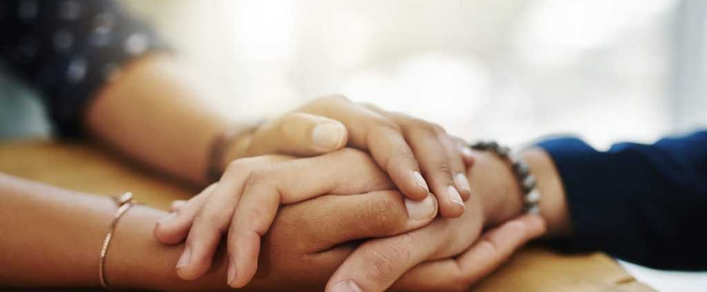 Holding hands in support