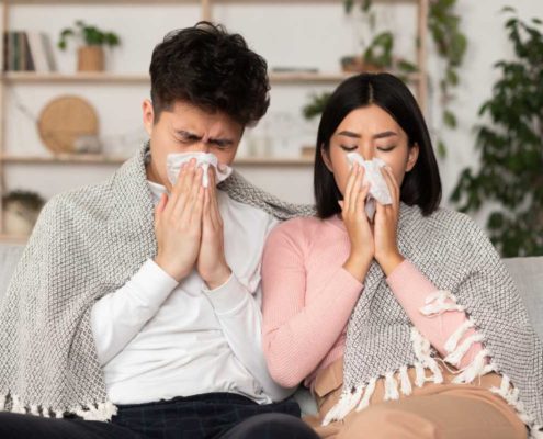 couple-home-sick-with-flu-cold-covid-symptoms